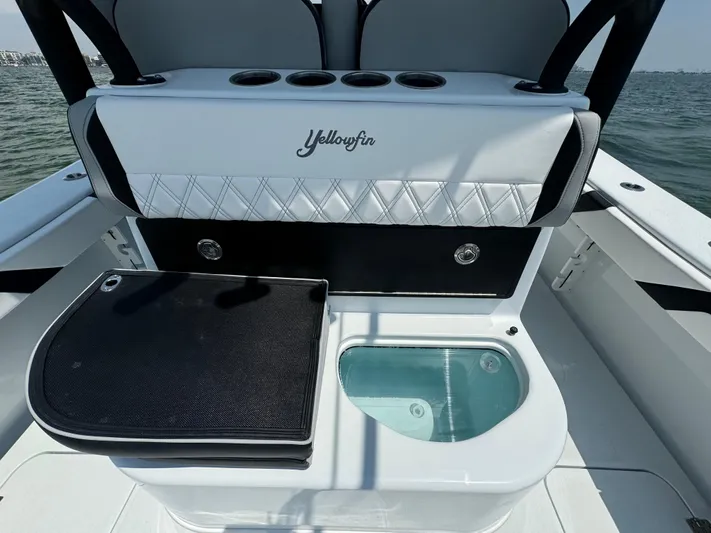  Yacht Photos Pics 2024 Yellowfin 34 Offshore boat interior with seating and storage compartments.