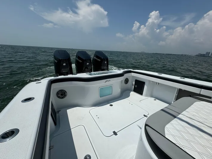  Yacht Photos Pics 2024 Yellowfin 34 Offshore boat with triple engines on open water.