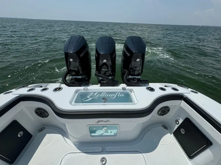  Yacht Photos Pics 2024 Yellowfin 34 Offshore boat with triple outboard engines on open water.