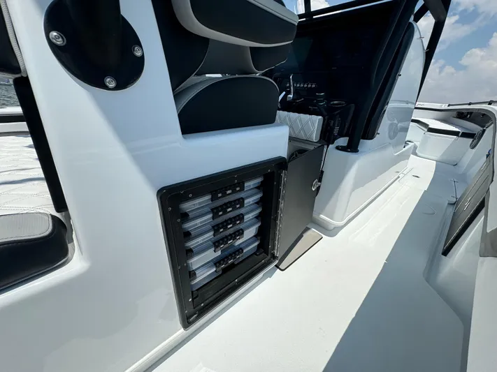  Yacht Photos Pics 2024 Yellowfin 34 Offshore boat interior with seating and storage compartments.