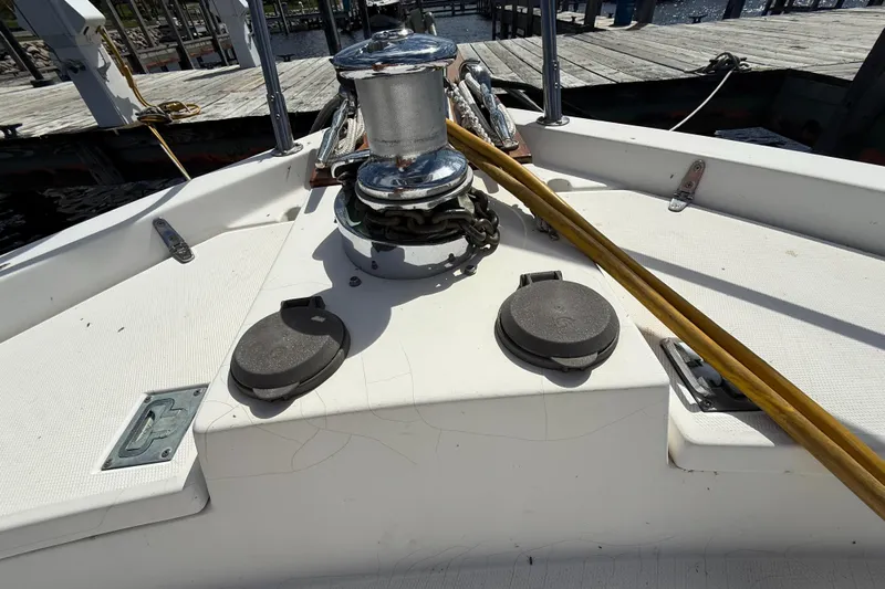  Yacht Photos Pics 1999 Sabreline 34 Flybridge deck with winch and mooring lines at dock.