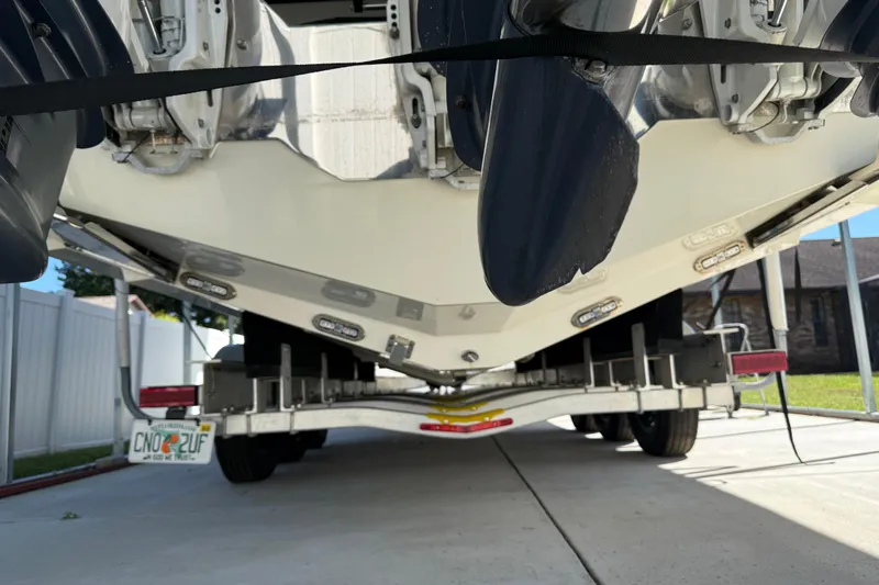  Yacht Photos Pics 2018 Cobia 344 Center Console boat on trailer, rear view showing engines and propellers.