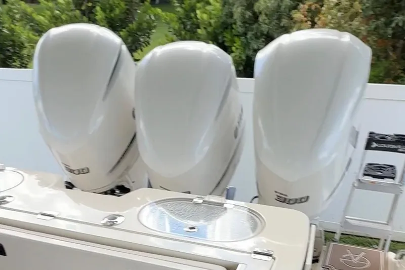  Yacht Photos Pics 2018 Cobia 344 Center Console with triple outboard engines, rear view.