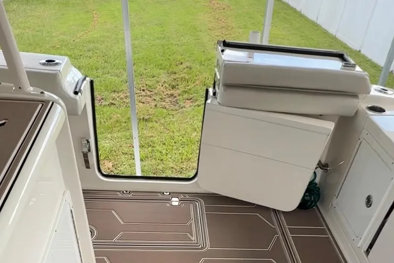  Yacht Photos Pics 2018 Cobia 344 Center Console interior with open door and sleek flooring design.