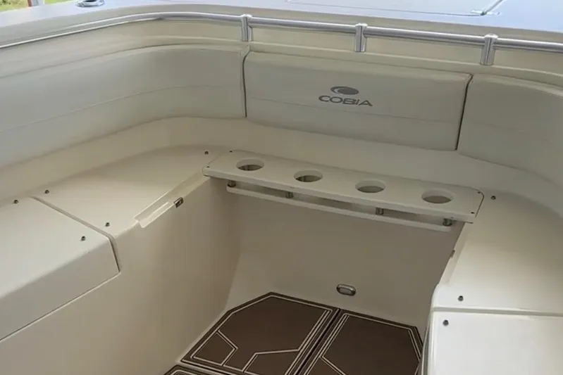  Yacht Photos Pics 2018 Cobia 344 Center Console boat interior with seating and rod holders.