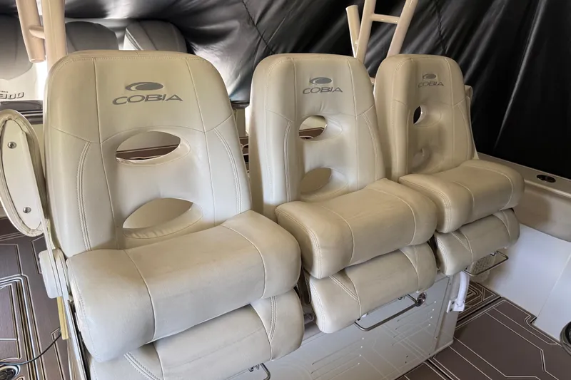  Yacht Photos Pics Three beige seats on a 2018 Cobia 344 Center Console boat.