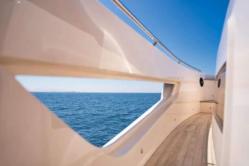  Yacht Photos Pics Cayman Yachts 380 WA 2025, sleek deck view, overlooking serene ocean and clear sky.