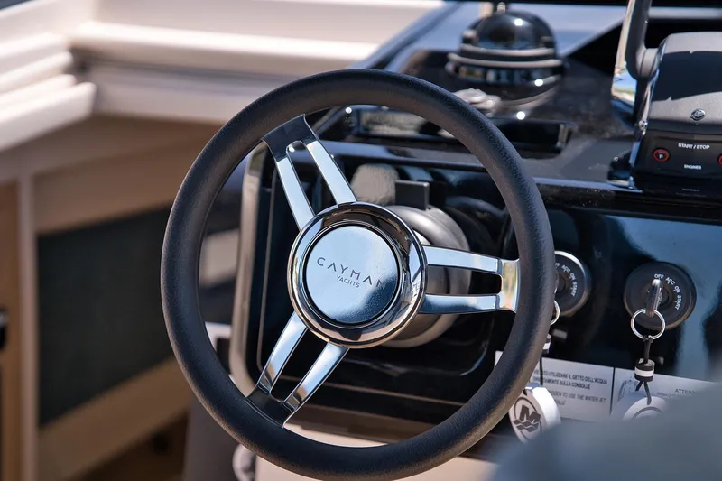  Yacht Photos Pics Steering wheel of 2025 Cayman Yachts 380 WA, showcasing sleek design and controls.