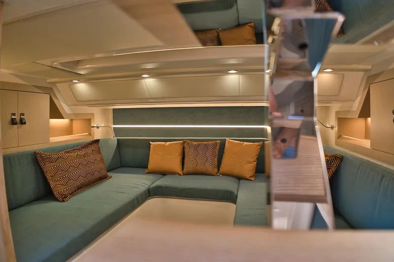  Yacht Photos Pics Luxurious interior of 2025 Cayman Yachts 380 WA with elegant seating and ambient lighting.