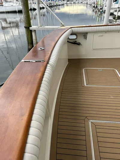 Bona Vida Yacht Photos Pics 1997 Ocean Yachts 48 Convertible boat deck with wood finish, docked at marina.