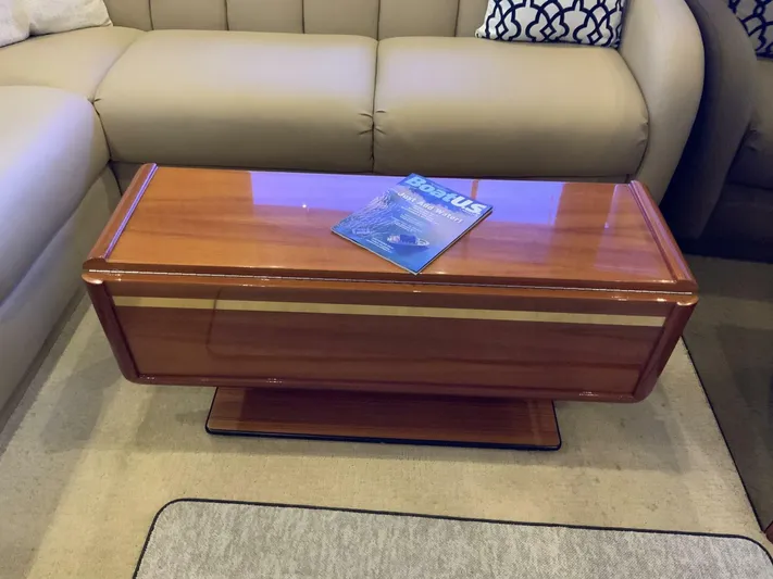 Bona Vida Yacht Photos Pics Luxurious interior of 1997 Ocean Yachts 48 Convertible with elegant wooden table.