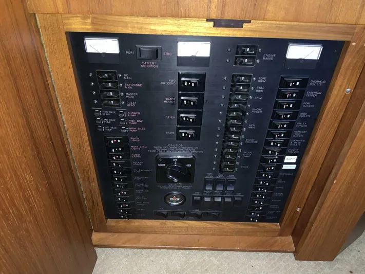 Bona Vida Yacht Photos Pics Electrical panel of a 1997 Ocean Yachts 48 Convertible boat, featuring various switches and controls.