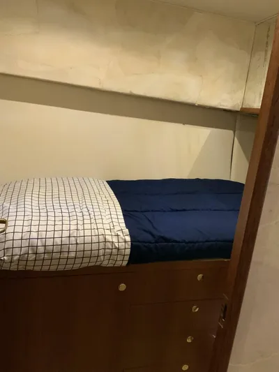 Bona Vida Yacht Photos Pics 1997 Ocean Yachts 48 Convertible cabin with bed and storage drawers.