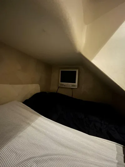 Bona Vida Yacht Photos Pics Cozy cabin interior of 1997 Ocean Yachts 48 Convertible with a small TV.