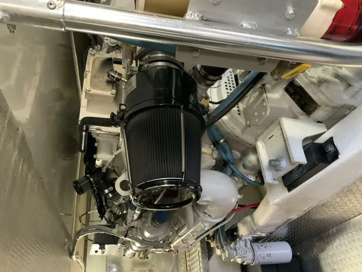 Bona Vida Yacht Photos Pics Engine room of 1997 Ocean Yachts 48 Convertible, showcasing mechanical components and systems.