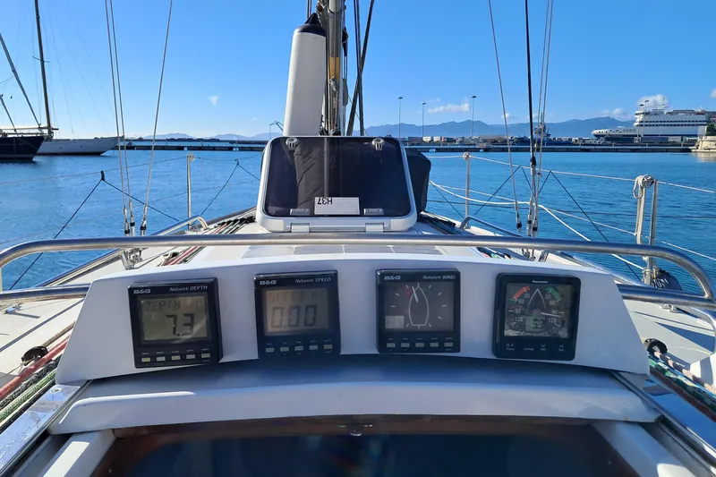  Yacht Photos Pics 1999 J Boats J/120 sailboat cockpit with navigation instruments, docked in a sunny marina.