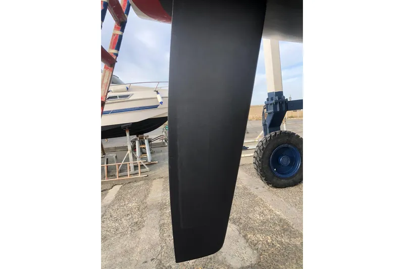  Yacht Photos Pics 1999 J Boats J/120 keel in dry dock, showcasing sleek design and craftsmanship.