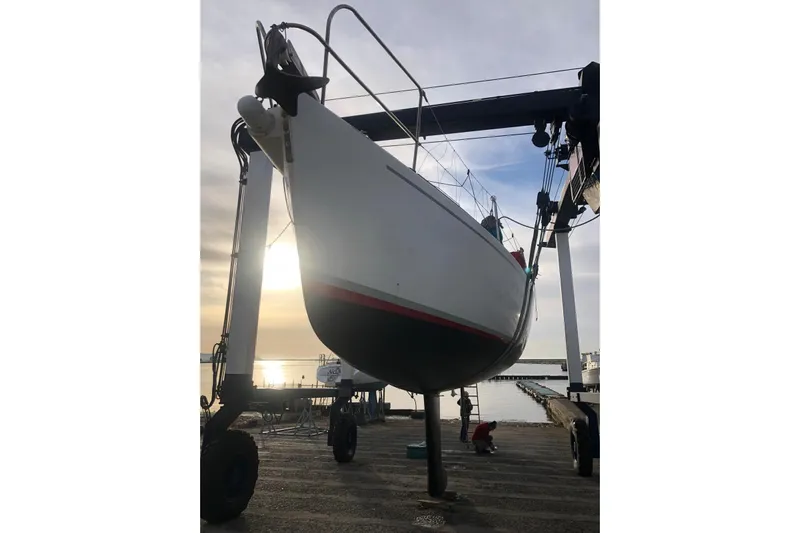  Yacht Photos Pics 1999 J Boats J/120 sailboat on lift at marina during sunset.