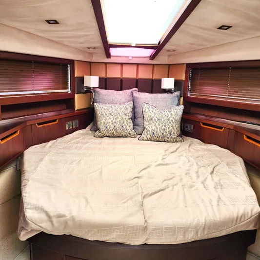 Makers Time Yacht Photos Pics Luxurious bedroom interior of 2018 Galeon 430 HTC yacht with elegant bedding and cushions.