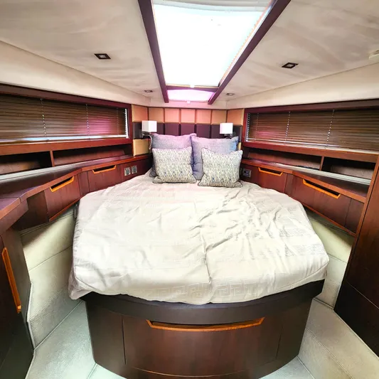 Makers Time Yacht Photos Pics Luxurious bedroom interior of 2018 Galeon 430 HTC yacht with elegant wood finishes.