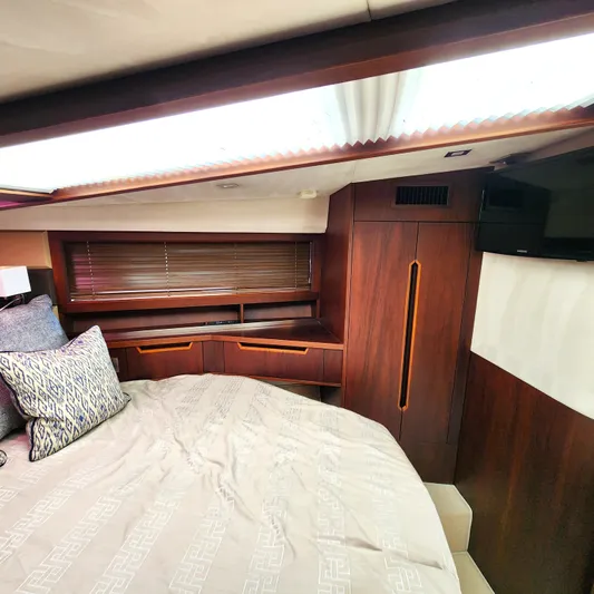 Makers Time Yacht Photos Pics Luxurious interior of 2018 Galeon 430 HTC yacht with elegant wood finishes and cozy bedding.