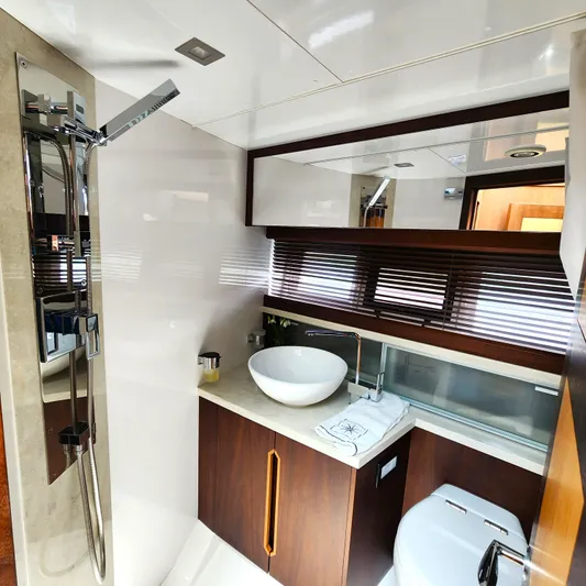 Makers Time Yacht Photos Pics Luxurious bathroom interior of 2018 Galeon 430 HTC yacht with modern fixtures.