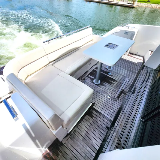 Makers Time Yacht Photos Pics Luxury seating area on 2018 Galeon 430 HTC yacht with elegant wooden deck.
