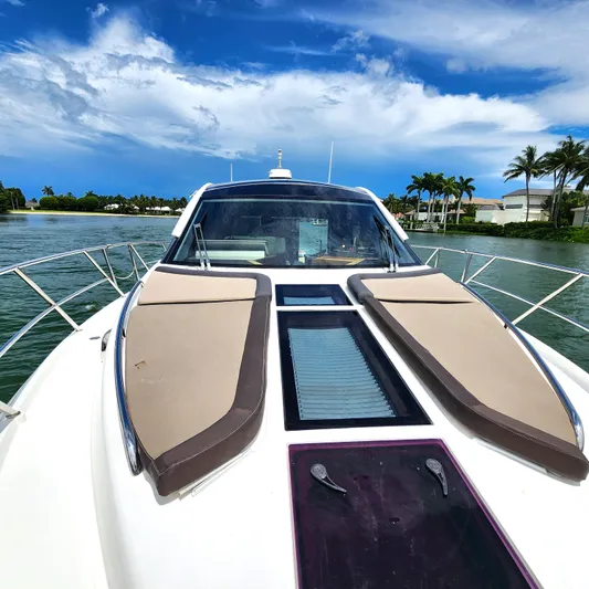 Makers Time Yacht Photos Pics 2018 Galeon 430 HTC yacht on water, featuring sleek design and sunbathing area.