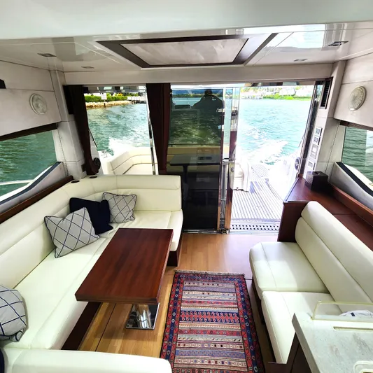 Makers Time Yacht Photos Pics Luxurious interior of 2018 Galeon 430 HTC yacht with elegant seating and scenic water view.