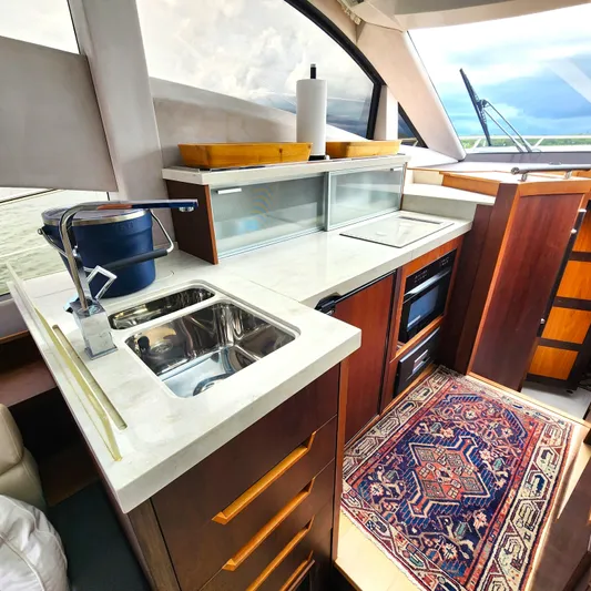 Makers Time Yacht Photos Pics Luxurious kitchen interior of 2018 Galeon 430 HTC yacht with modern amenities and elegant design.
