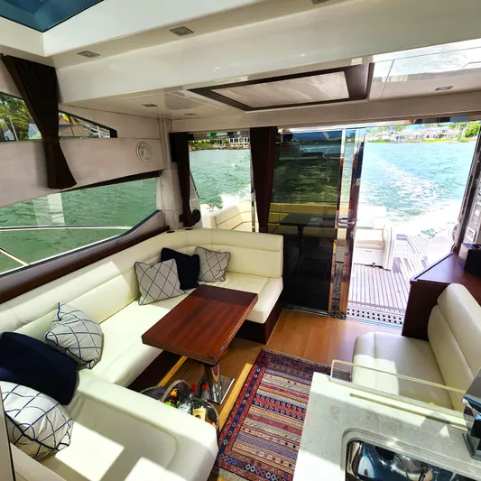 Makers Time Yacht Photos Pics Luxurious interior of 2018 Galeon 430 HTC yacht with elegant seating and scenic water view.