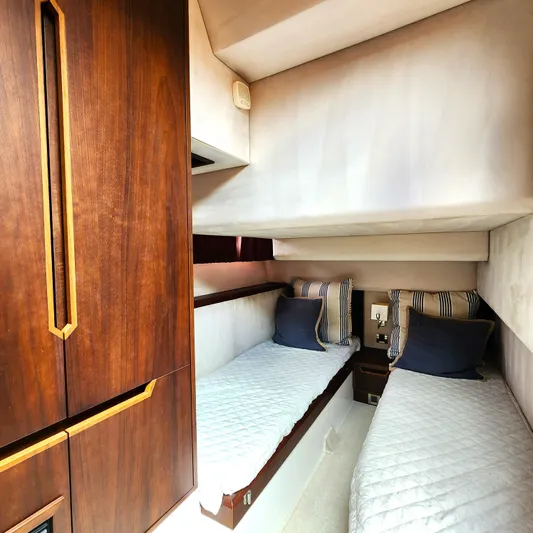 Makers Time Yacht Photos Pics Luxurious twin cabin interior of 2018 Galeon 430 HTC yacht with elegant wood finish.