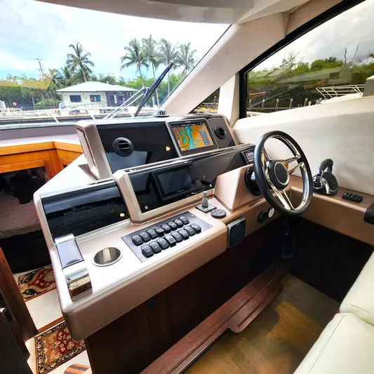 Makers Time Yacht Photos Pics Helm of 2018 Galeon 430 HTC yacht with modern navigation equipment and steering wheel.