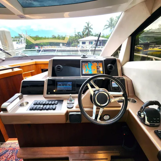 Makers Time Yacht Photos Pics Helm of 2018 Galeon 430 HTC yacht with navigation screens and controls.