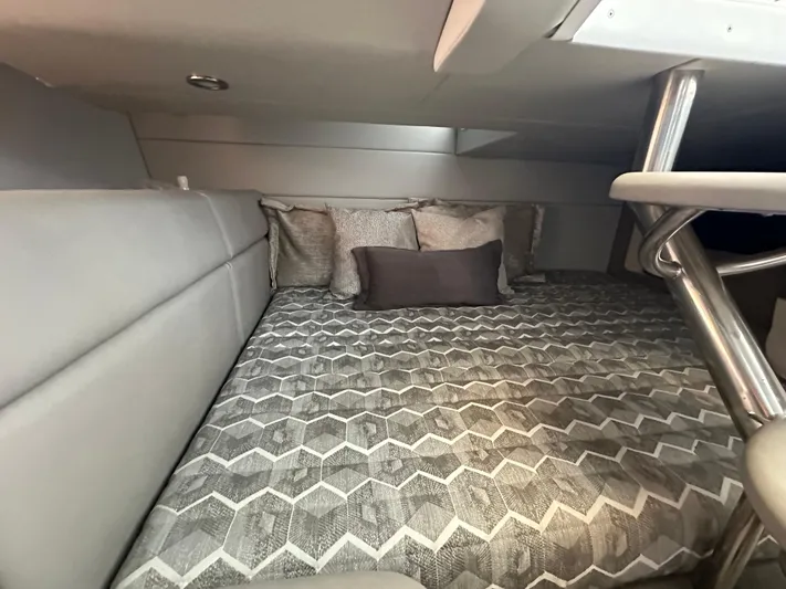  Yacht Photos Pics 2020 Formula 350 Crossover Bowrider OB cabin interior with patterned bedding and cushions.