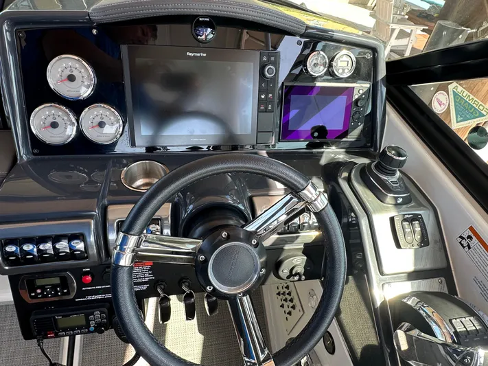 Yacht Photos Pics 2020 Formula 350 Crossover Bowrider OB dashboard with steering wheel and navigation controls.