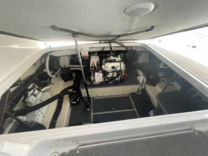  Yacht Photos Pics Engine compartment of 2020 Formula 350 Crossover Bowrider OB, showcasing mechanical components.