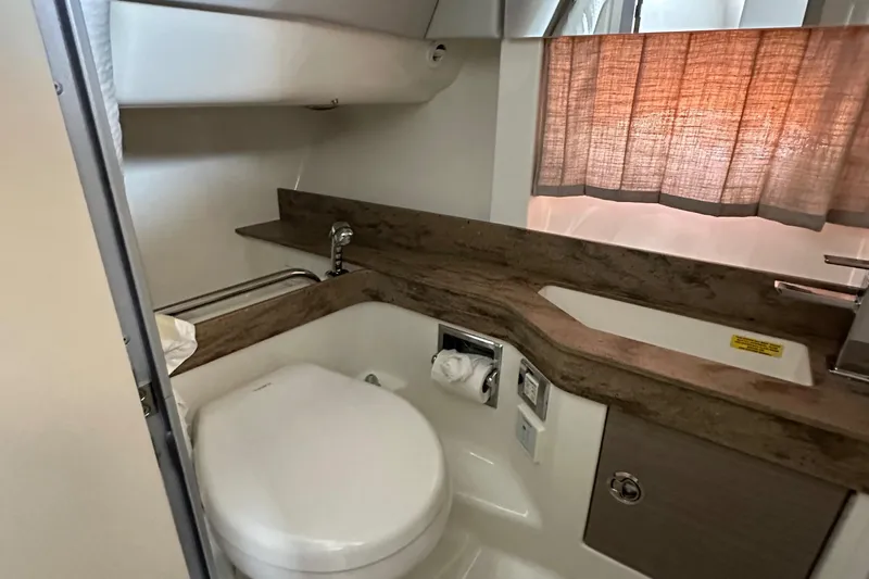  Yacht Photos Pics 2020 Formula 350 Crossover Bowrider OB bathroom interior with modern fixtures and wood accents.
