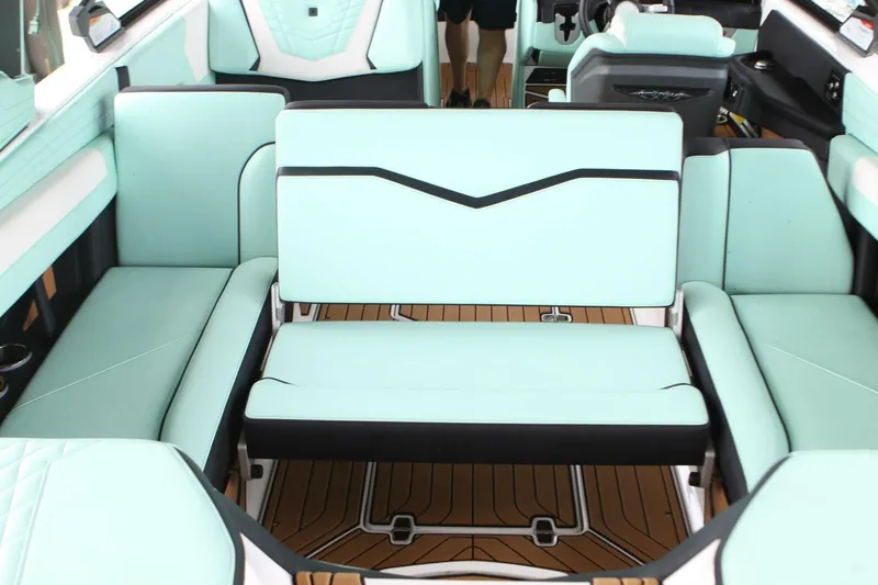  Yacht Photos Pics 2024 Nautique Super Air Nautique G23 interior with mint green seating and teak flooring.