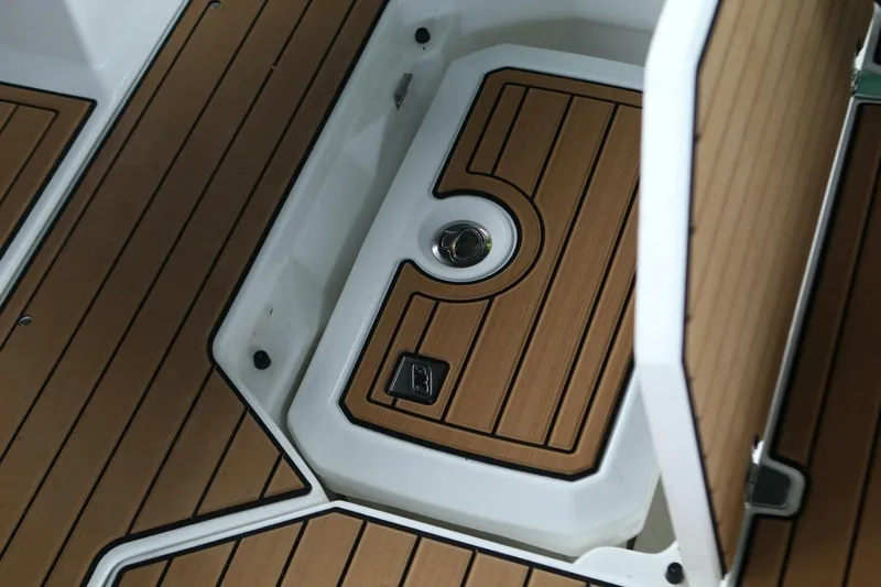  Yacht Photos Pics 2024 Nautique Super Air Nautique G23 boat interior with teak flooring detail.