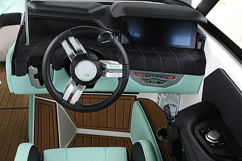  Yacht Photos Pics 2024 Nautique Super Air Nautique G23 helm with modern steering and controls.