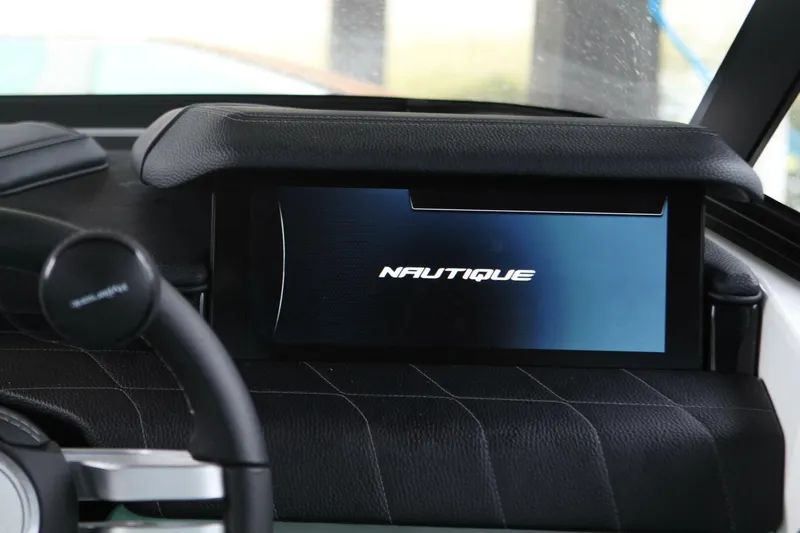  Yacht Photos Pics 2024 Nautique Super Air Nautique G23 dashboard display with logo.