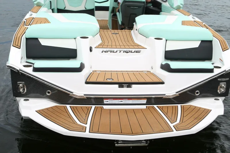  Yacht Photos Pics 2024 Nautique Super Air Nautique G23 boat with teak deck and mint green seating.