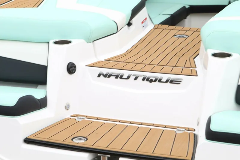  Yacht Photos Pics 2024 Nautique Super Air Nautique G23 boat deck with teak flooring and mint seating.