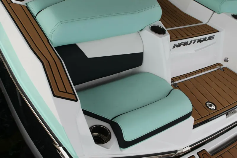  Yacht Photos Pics 2024 Nautique Super Air Nautique G23 interior with teal and black seating, teak flooring.