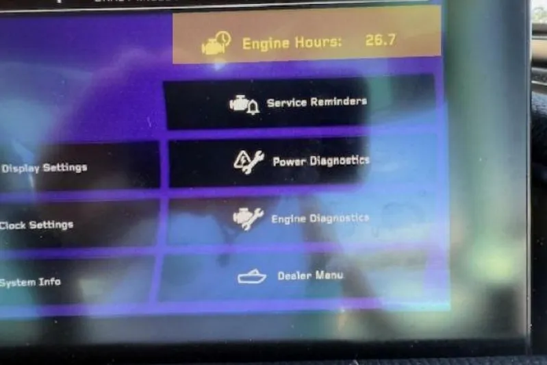  Yacht Photos Pics 2024 Nautique Super Air Nautique G23 dashboard displaying engine hours and diagnostics menu.