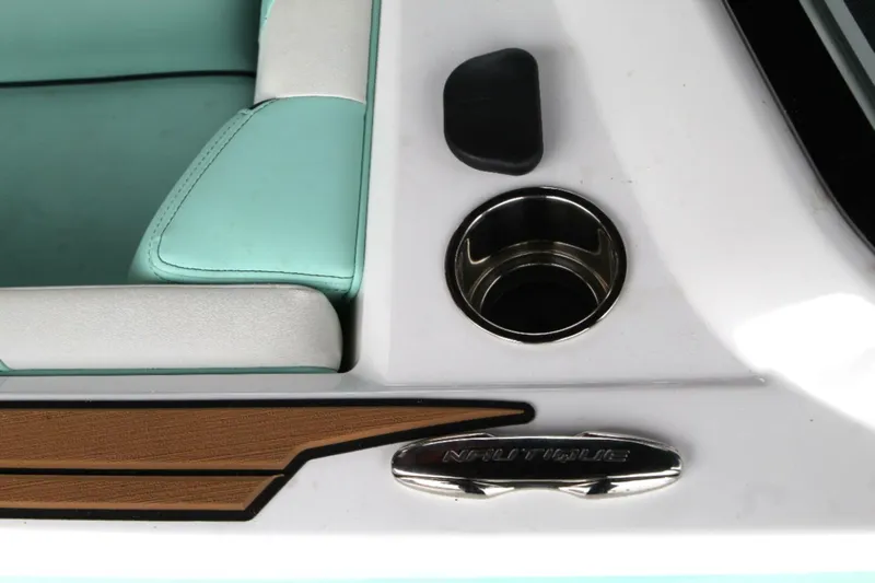  Yacht Photos Pics 2024 Nautique Super Air Nautique G23 interior detail with teal upholstery and cup holder.