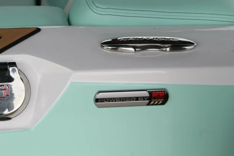  Yacht Photos Pics 2024 Nautique Super Air Nautique G23, mint green and white, PCM engine badge.