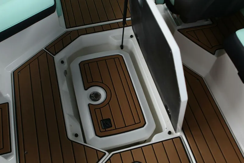  Yacht Photos Pics 2024 Nautique Super Air Nautique G23 storage compartment with teak-style flooring.