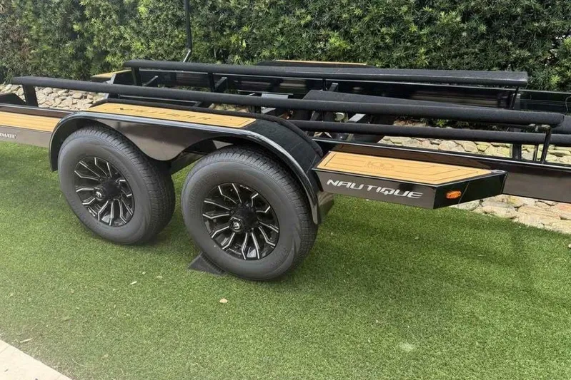  Yacht Photos Pics Trailer for 2024 Nautique Super Air Nautique G23 on grass.